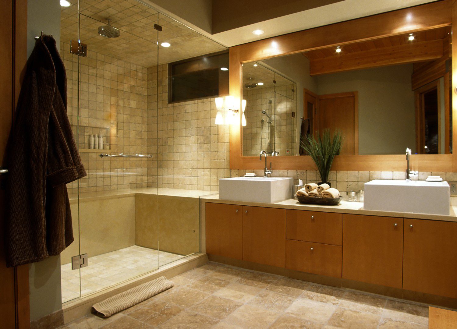 Modern bathroom with double sinks and shower.